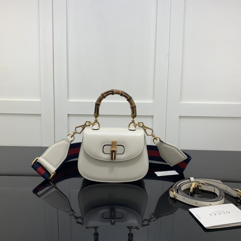 G*u*i top handle bags